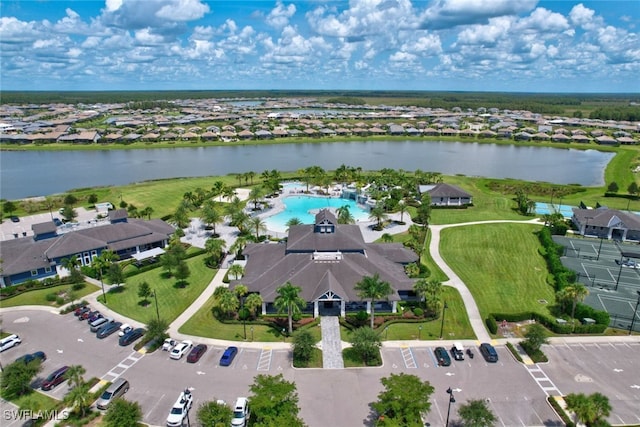 bird's eye view featuring a water view and a residential view