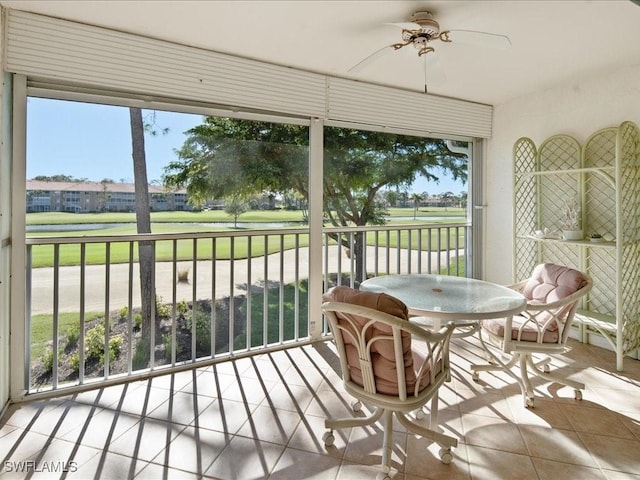 sunroom featuring ceiling fan and a healthy amount of sunlight