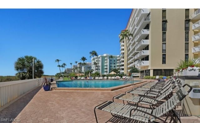 view of swimming pool featuring a patio area