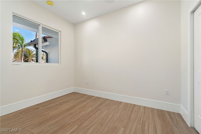 spare room featuring light hardwood / wood-style floors