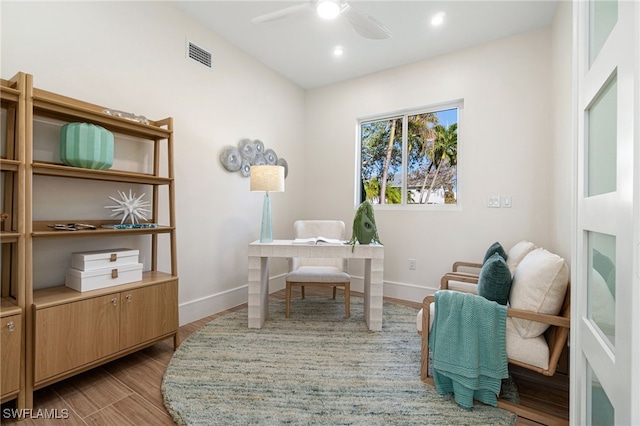 office space with ceiling fan and light hardwood / wood-style floors