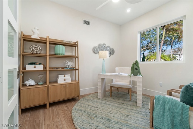 home office featuring ceiling fan and hardwood / wood-style floors