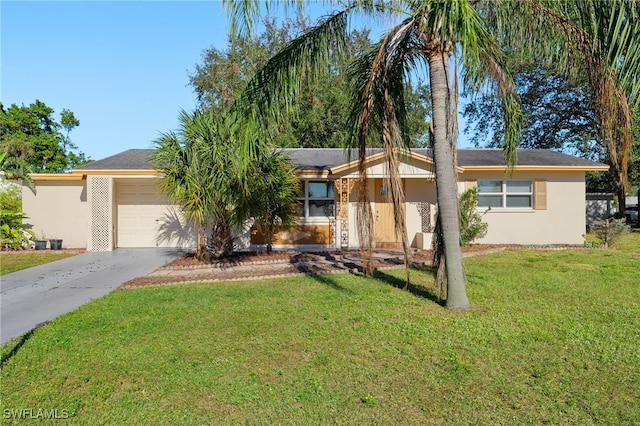 ranch-style house with a garage and a front lawn