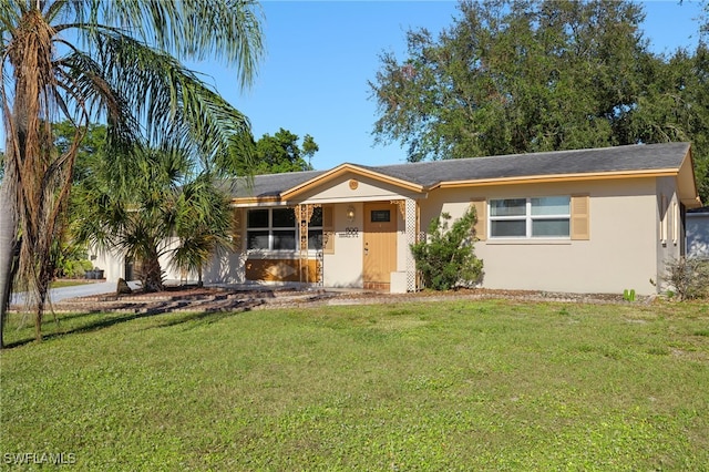 ranch-style house with a front lawn