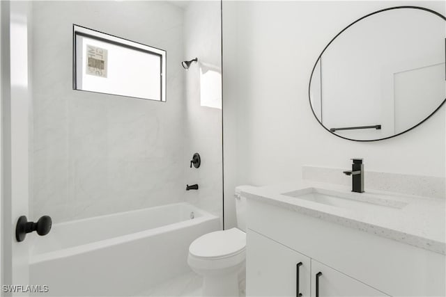 full bathroom with toilet, vanity, and tiled shower / bath