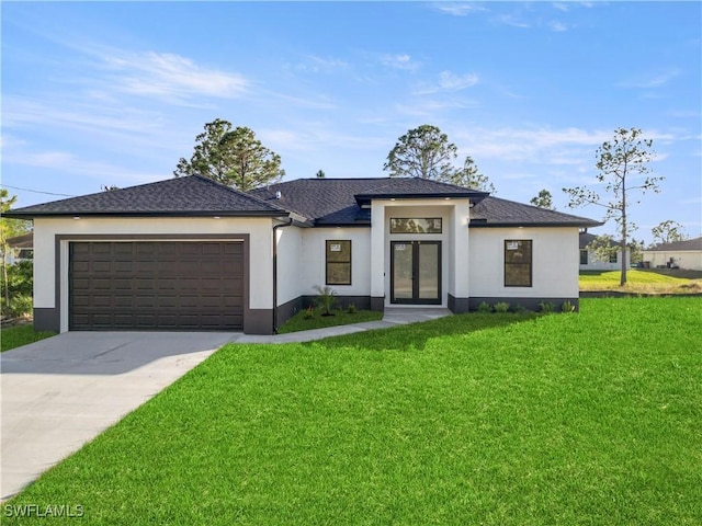 view of front of property featuring french doors, stucco siding, a garage, driveway, and a front lawn