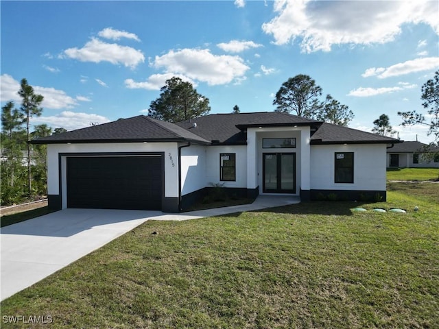 view of front of house featuring an attached garage, concrete driveway, french doors, stucco siding, and a front yard