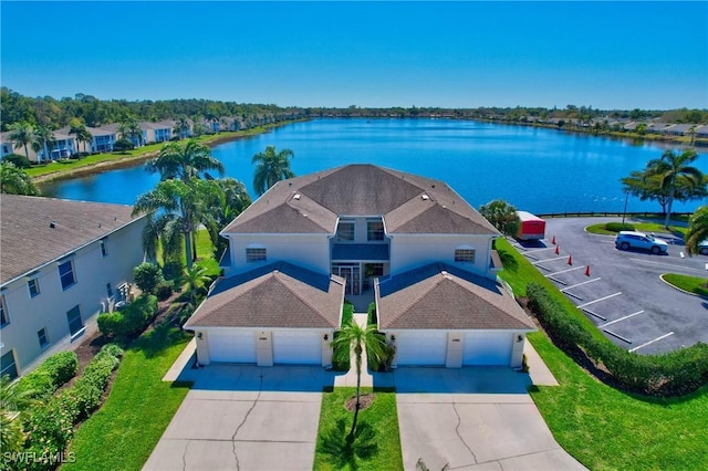 birds eye view of property with a water view