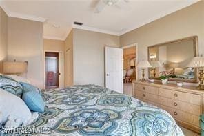 bedroom with crown molding and ceiling fan