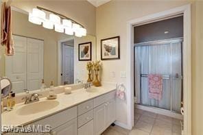 bathroom with tile patterned flooring and vanity