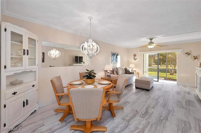 dining space featuring ornamental molding, ceiling fan with notable chandelier, and a textured ceiling