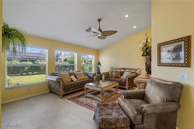 living room with ceiling fan and vaulted ceiling