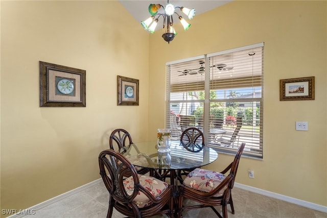 tiled dining area featuring a notable chandelier