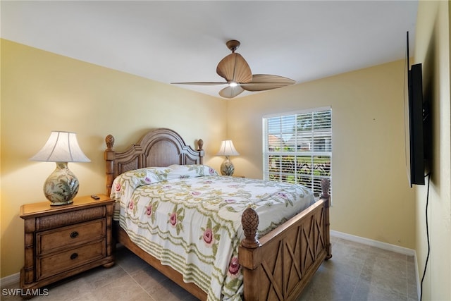 bedroom with tile patterned floors and ceiling fan