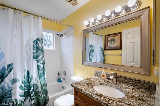 full bathroom featuring shower / bath combo, toilet, and vanity