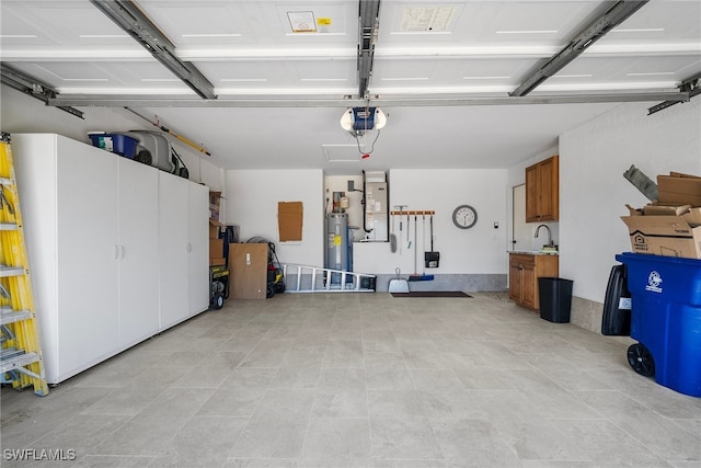 garage with water heater and a garage door opener