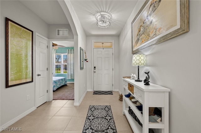 entryway featuring light tile patterned flooring