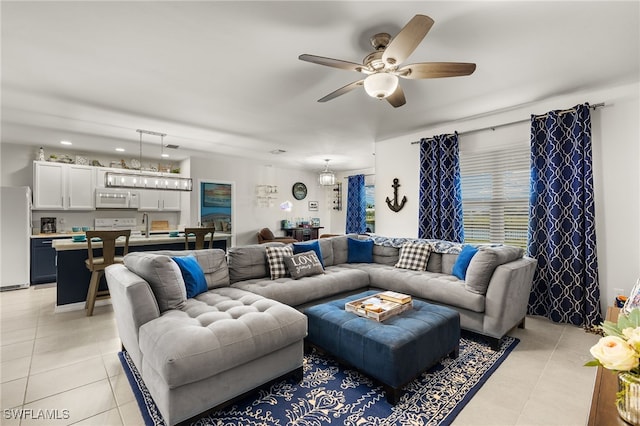 tiled living room featuring ceiling fan