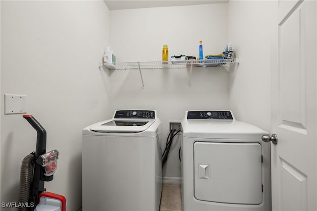 clothes washing area featuring washing machine and dryer