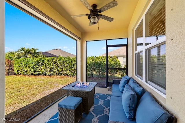 sunroom featuring ceiling fan