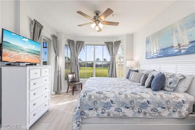 bedroom featuring light hardwood / wood-style flooring and ceiling fan