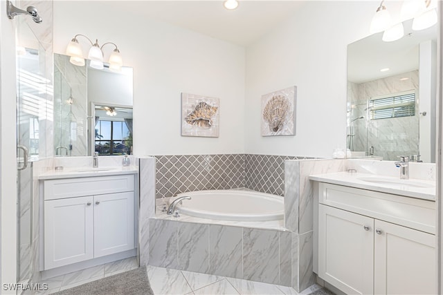 bathroom with ceiling fan, vanity, and shower with separate bathtub