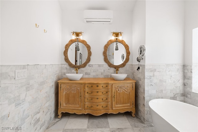 bathroom featuring a wall unit AC, vanity, a bath, and tile walls