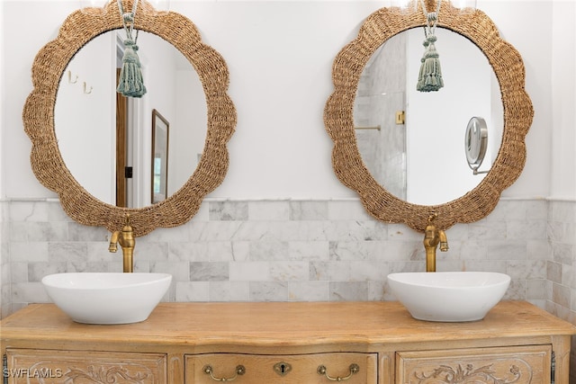 bathroom with vanity and tile walls