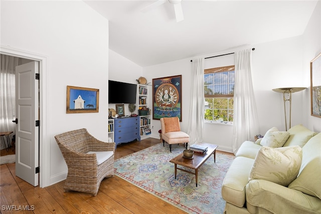 living room with hardwood / wood-style flooring and lofted ceiling