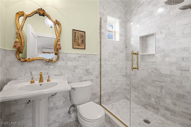 bathroom with walk in shower, tile walls, and toilet