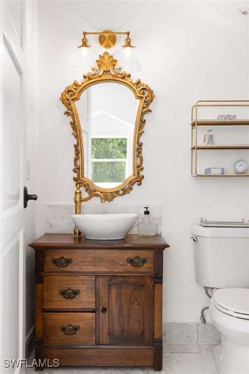 bathroom with vanity and toilet