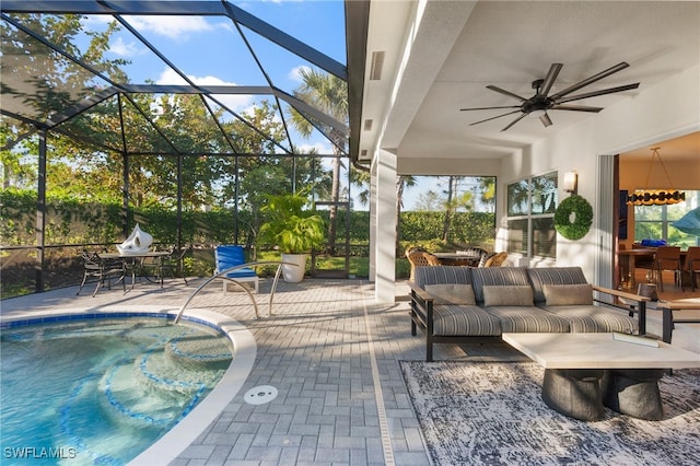 view of patio / terrace with outdoor lounge area, ceiling fan, and glass enclosure