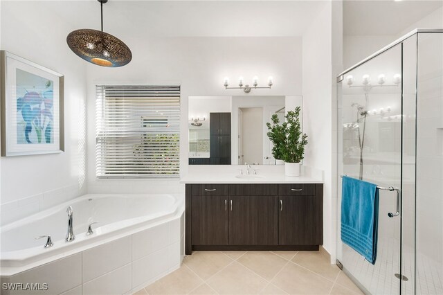 bathroom featuring vanity, separate shower and tub, and tile patterned floors