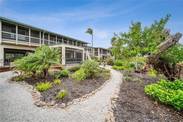 view of yard featuring a sunroom