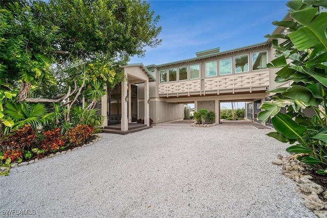 view of front of home with a carport