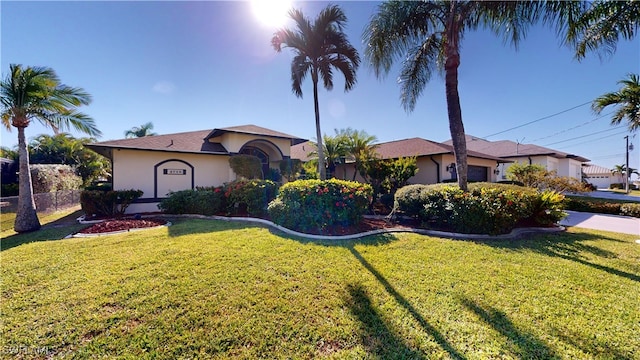 view of front of property with a front lawn