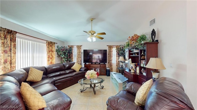 living room with ceiling fan and light tile patterned floors