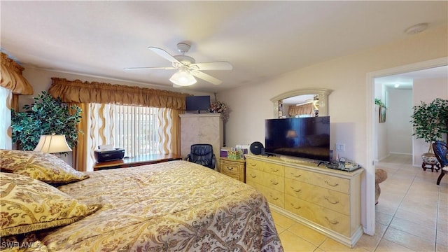 bedroom with light tile patterned floors and ceiling fan