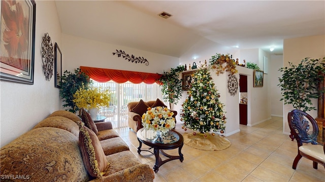 tiled living room with lofted ceiling