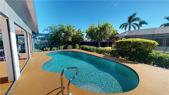 view of pool with a lanai