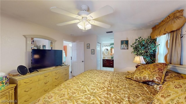 bedroom featuring ensuite bathroom and ceiling fan