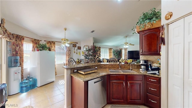 kitchen with stainless steel dishwasher, plenty of natural light, kitchen peninsula, and sink