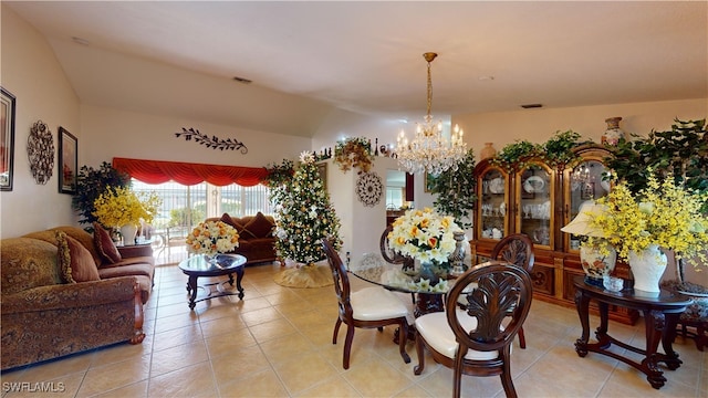 2718 SW 37th St, Cape Coral, FL 33914 - dining room featuring a chandelier, light tile patterned flooring, and vaulted ceiling