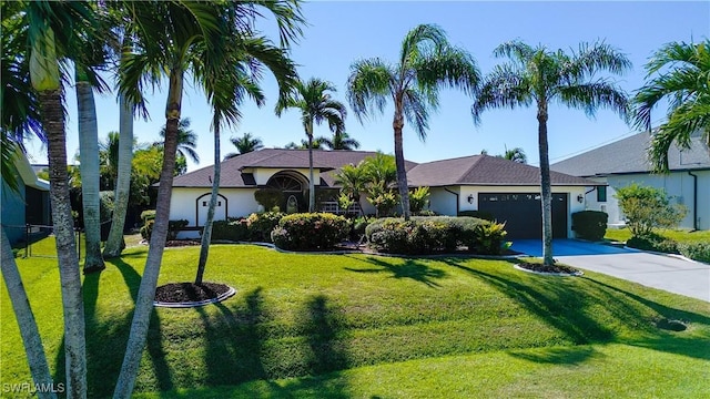 2718 SW 37th St, Cape Coral, FL 33914 - single story home with driveway, an attached garage, a front lawn, and stucco siding