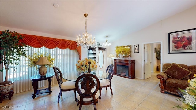 dining area with plenty of natural light, lofted ceiling, and light tile patterned floors