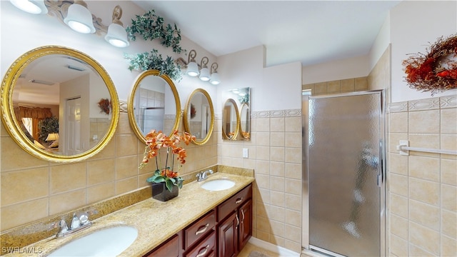 2718 SW 37th St, Cape Coral, FL 33914 - full bath featuring tile walls, double vanity, and a stall shower
