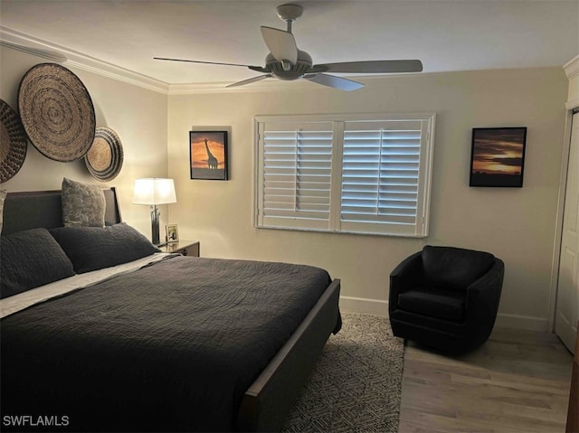 bedroom with ceiling fan, light hardwood / wood-style flooring, and ornamental molding