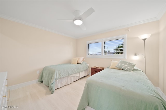 bedroom with light wood-type flooring, ceiling fan, and crown molding