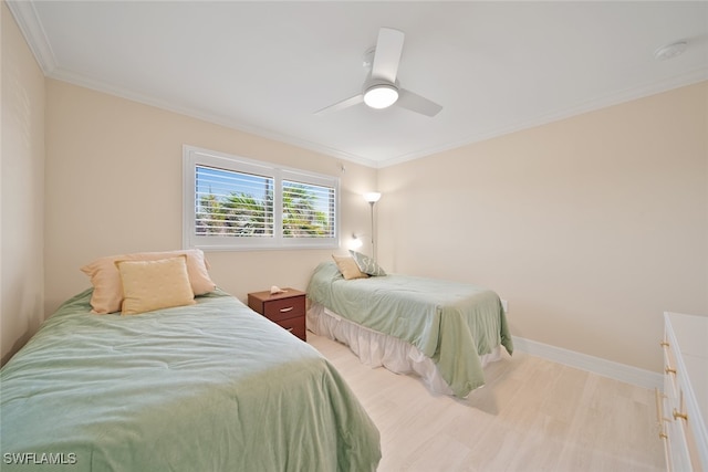 bedroom with ceiling fan, crown molding, and light wood-type flooring