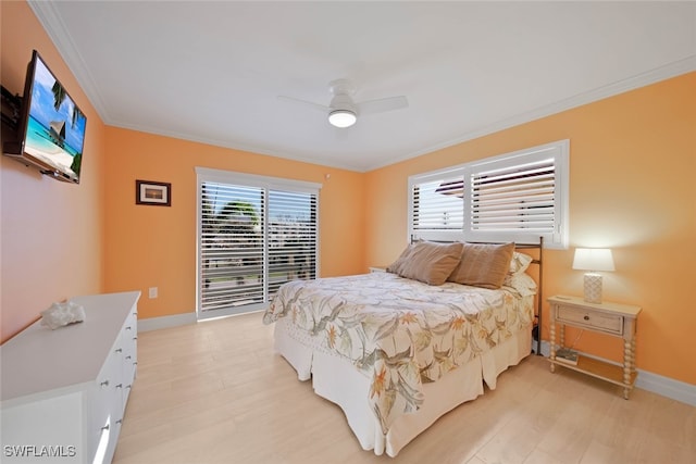 bedroom with ceiling fan, crown molding, and light hardwood / wood-style flooring